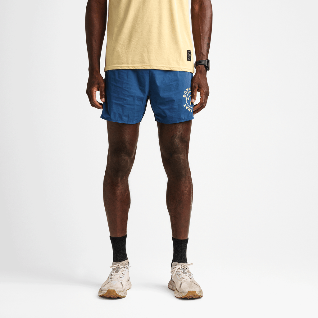 Roark Men's Running Gear | on body view of the Alta 5" Shorts in Denim Blue. Big Image - 2