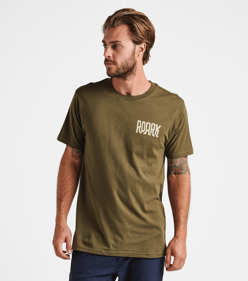 The front view of Roark's By Any Means Tee in Army. Big Image - 2