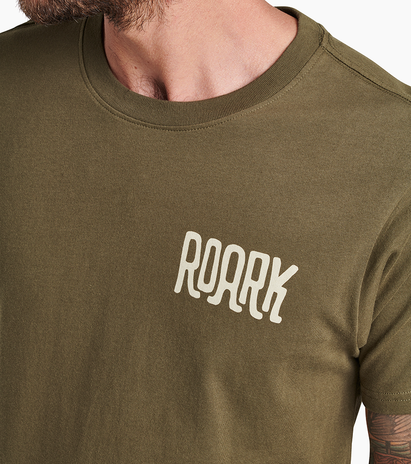 The front view of Roark's By Any Means Tee in Army. Big Image - 5
